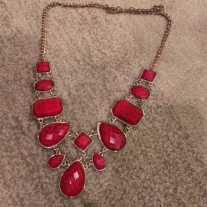 Slightly worn red necklace